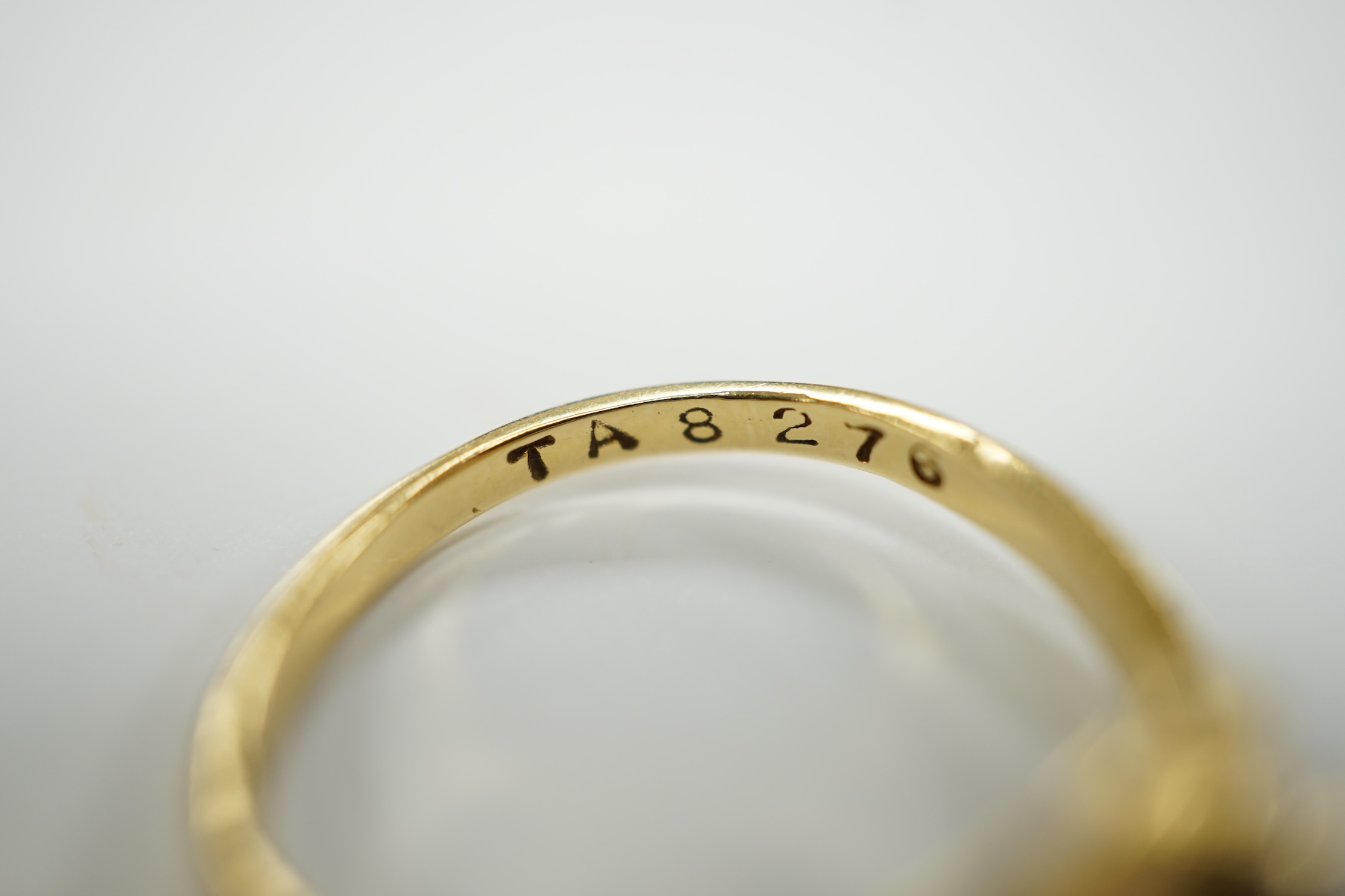 A modern 18ct gold and graduated seven stone diamond set half hoop ring, size O and a similar solitaire diamond ring with crossover setting, gross weight 6.4 grams.